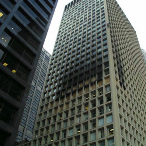 Chicago office building showing black smoke damage around several windows