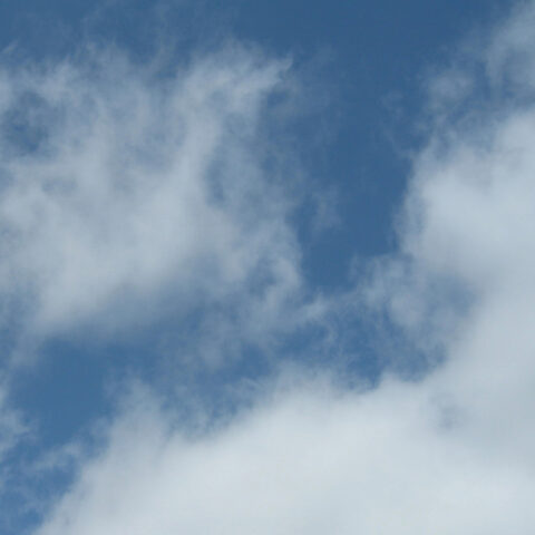 wispy white clouds on a blue sky
