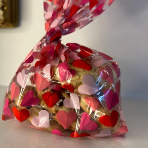 Little cookies in a clear bag decorated with red hearts