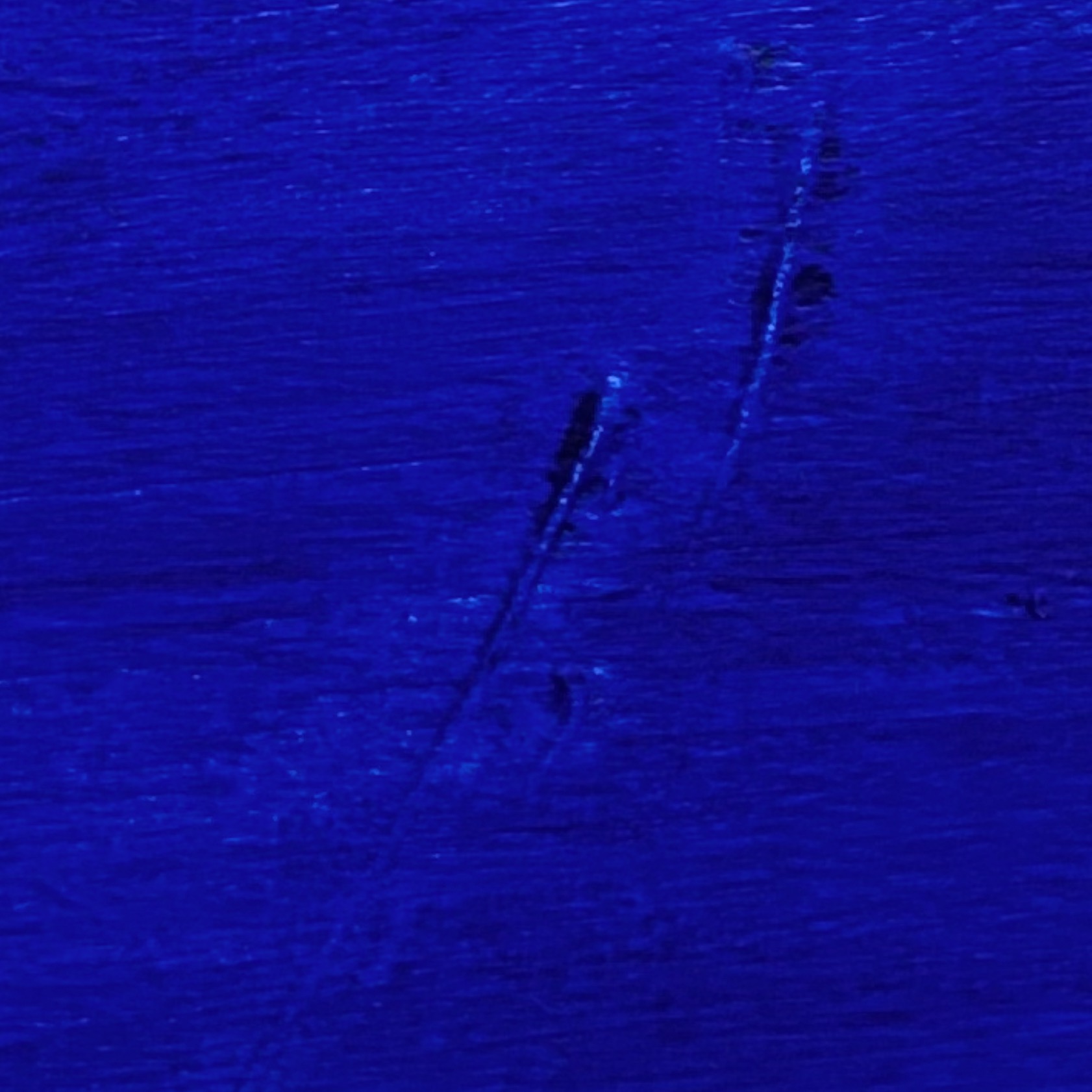 Abstract blue paint with two upward curving lines