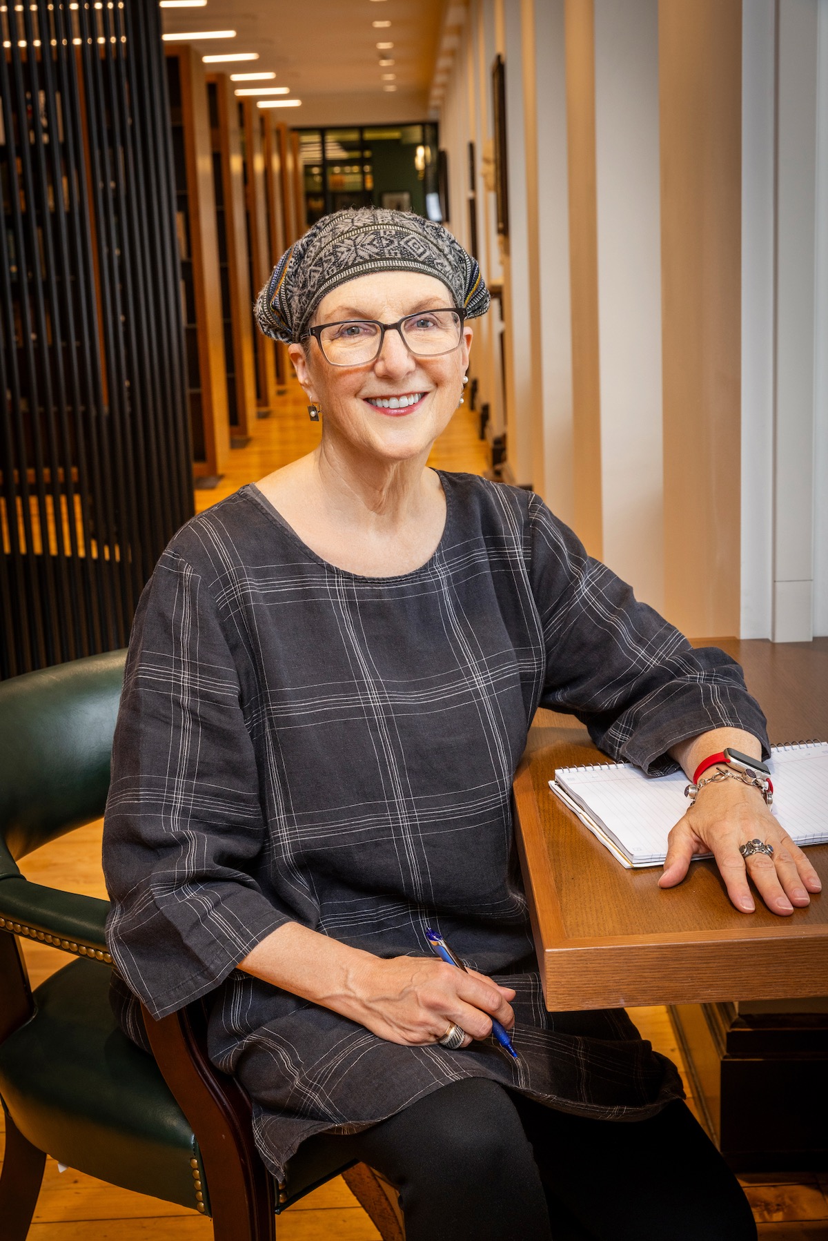 Jule, seated in at a library desk