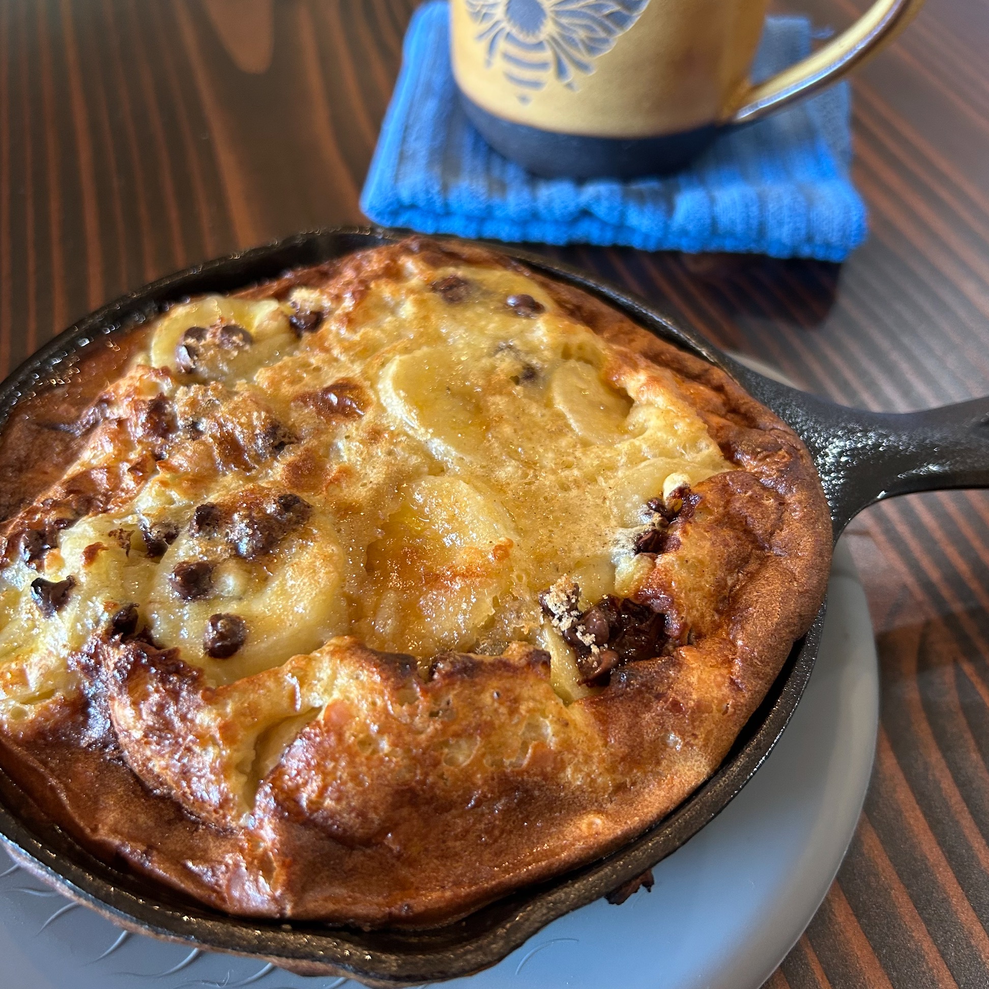 StevesBreakfast Baked egg pancake with apples, bananas and chocolate chips, in a small cast iron fry pan